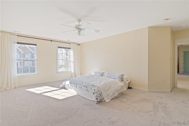 bedroom with carpet, ceiling fan, and baseboards