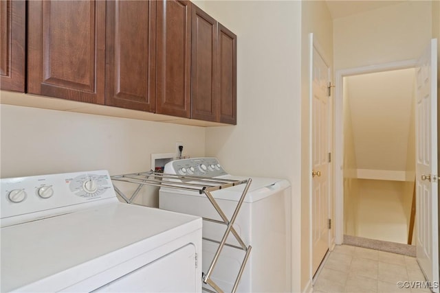 laundry area featuring cabinet space and washing machine and clothes dryer