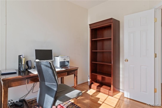 home office with wood finished floors