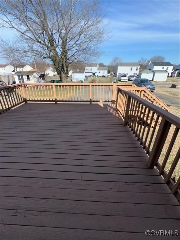 wooden deck with a residential view