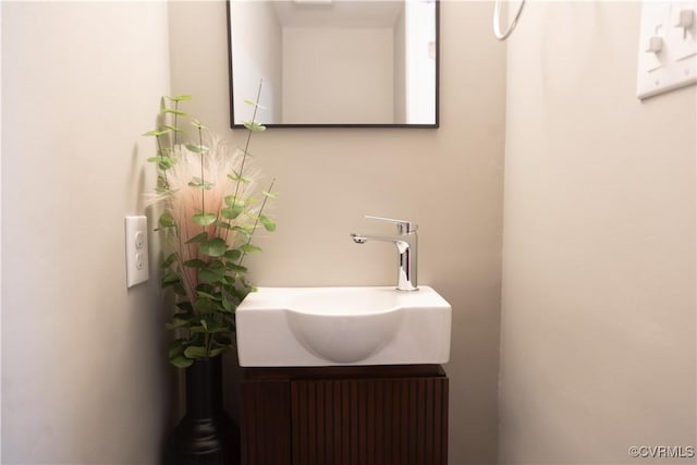 bathroom featuring radiator heating unit and vanity