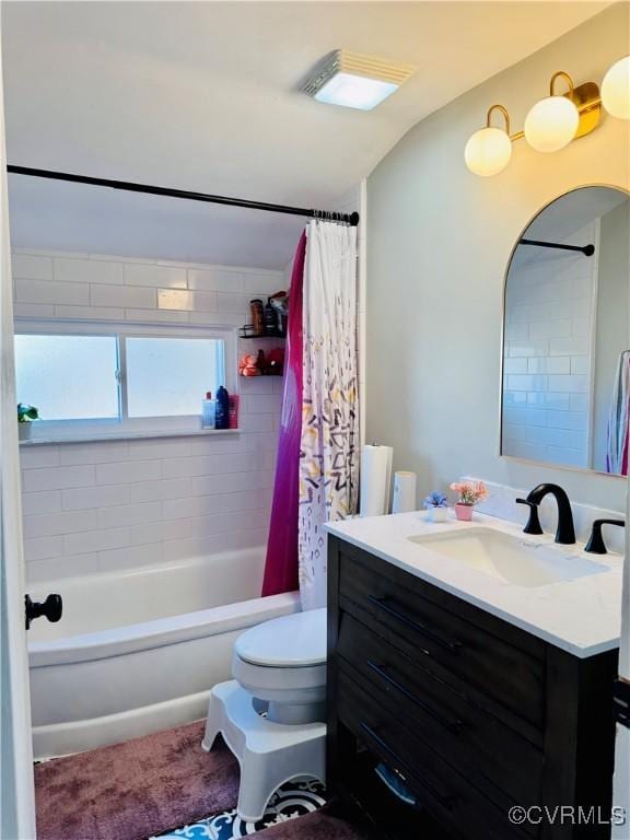 full bathroom featuring vanity, toilet, and shower / tub combo