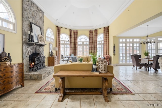 sitting room with ornamental molding, a healthy amount of sunlight, and light tile patterned floors