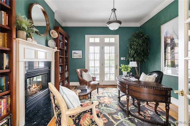 office space with crown molding, hardwood / wood-style floors, a multi sided fireplace, and french doors