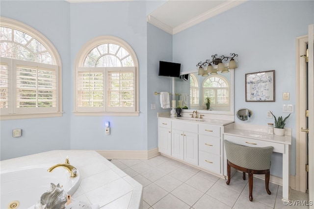 bathroom featuring a healthy amount of sunlight, a tub to relax in, tile patterned flooring, and vanity