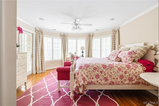 bedroom with crown molding, ceiling fan, and light hardwood / wood-style flooring