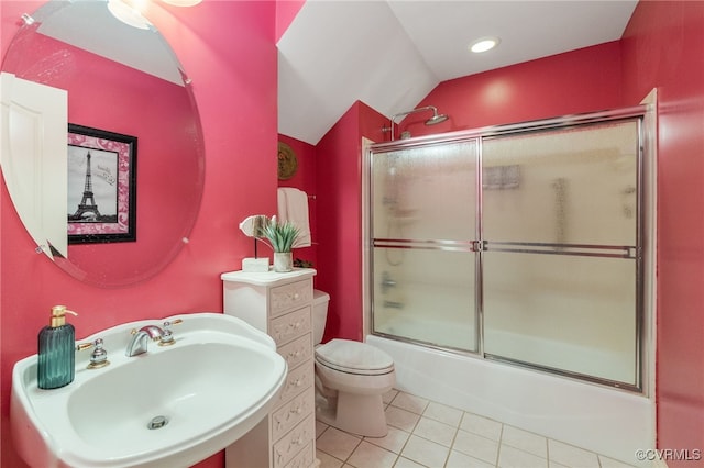 full bathroom with lofted ceiling, sink, bath / shower combo with glass door, tile patterned floors, and toilet