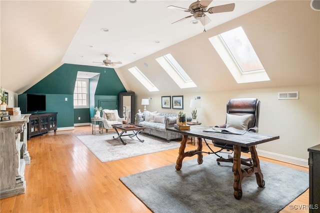 office space featuring ceiling fan, wood-type flooring, and vaulted ceiling