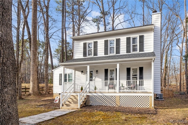 view of front of home with a porch and cooling unit