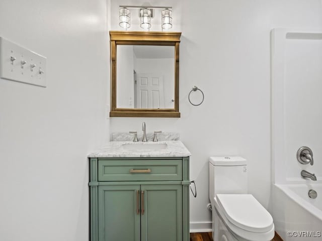 full bathroom featuring vanity, toilet, and  shower combination