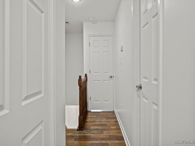 hallway featuring dark hardwood / wood-style floors