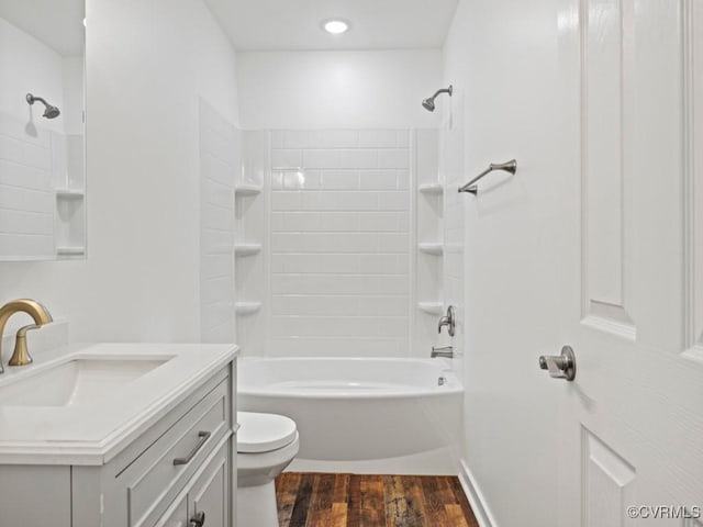 full bathroom featuring vanity, toilet, hardwood / wood-style floors, and shower / bathing tub combination