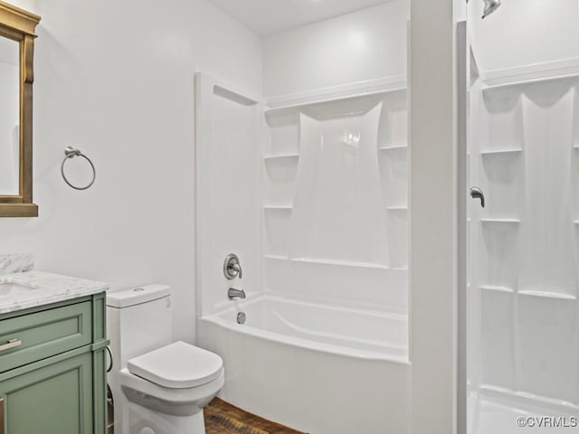 full bathroom with vanity, shower / bathtub combination, and toilet