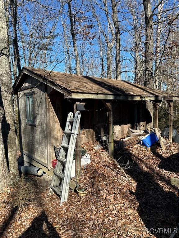 view of side of home with an outbuilding