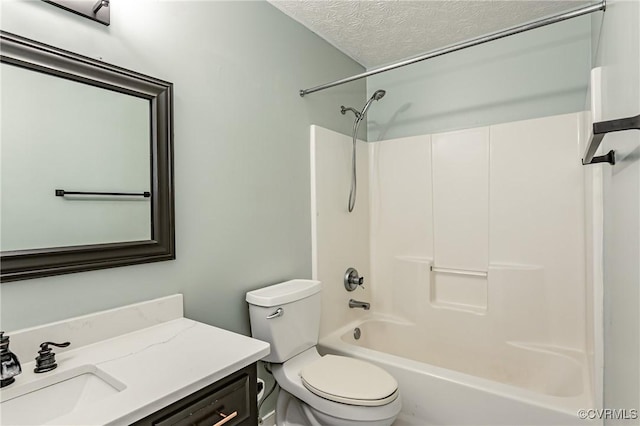 full bathroom with shower / bath combination, vanity, a textured ceiling, and toilet