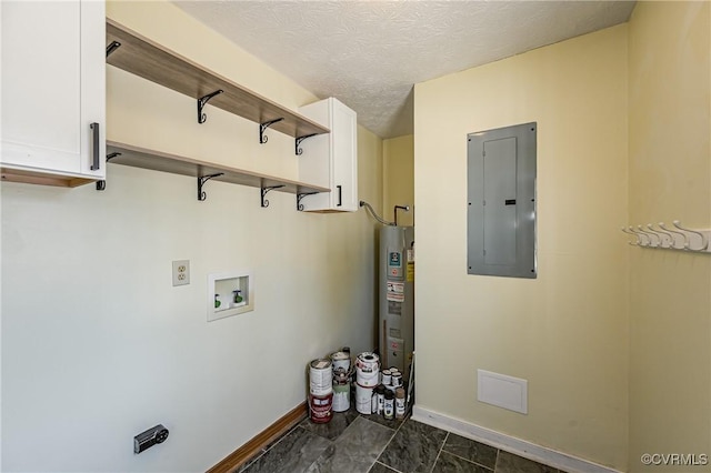 washroom with washer hookup, electric panel, cabinets, and a textured ceiling