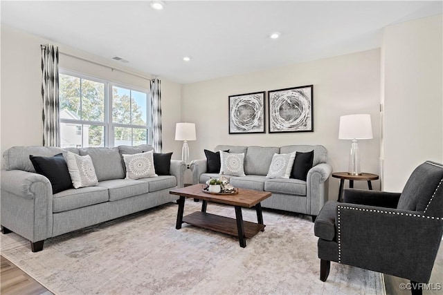 living room with light hardwood / wood-style floors