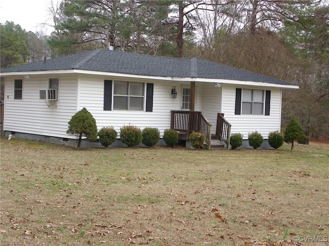 single story home featuring cooling unit and a front yard