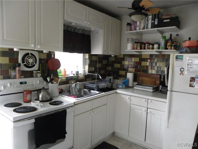 10500 Georgetown Rd, Hanover, VA 23116 - kitchen with white cabinetry, sink, decorative backsplash, ceiling fan, and white appliances