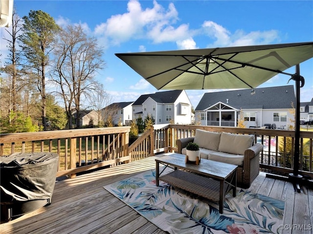 deck featuring outdoor lounge area