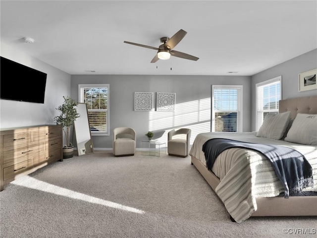 bedroom with ceiling fan and carpet flooring