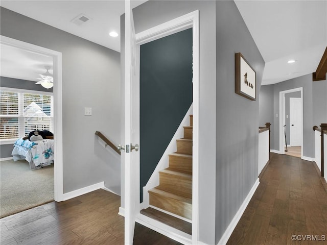 stairs with wood-type flooring