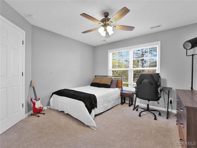 carpeted bedroom featuring ceiling fan