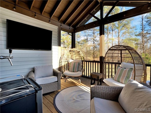 wooden deck featuring an outdoor living space