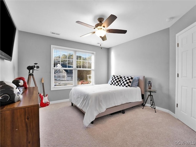 carpeted bedroom with ceiling fan