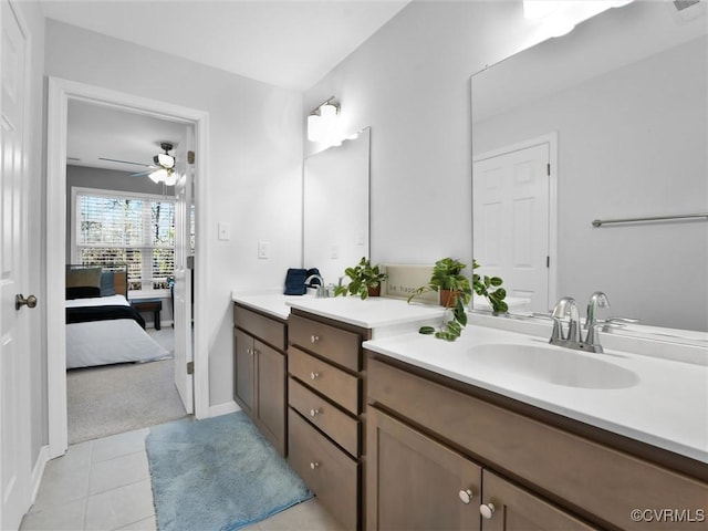 bathroom with ceiling fan, vanity, and tile patterned flooring