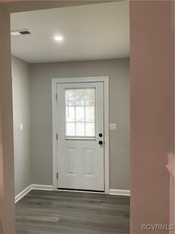 doorway with dark wood-type flooring