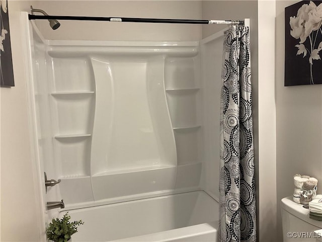 bathroom with shower / bath combo with shower curtain and toilet