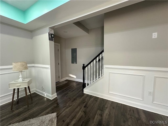 foyer entrance with electric panel and dark hardwood / wood-style floors