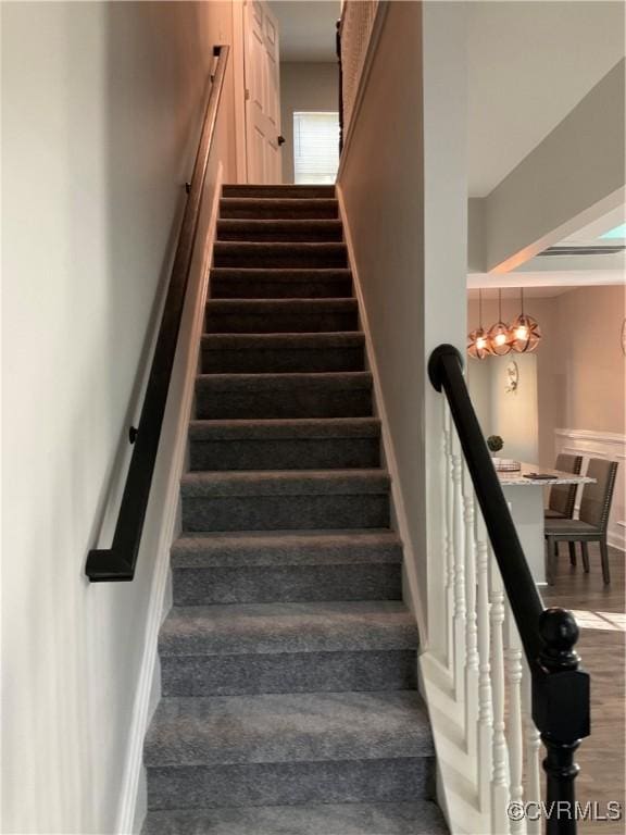 stairway with wood-type flooring