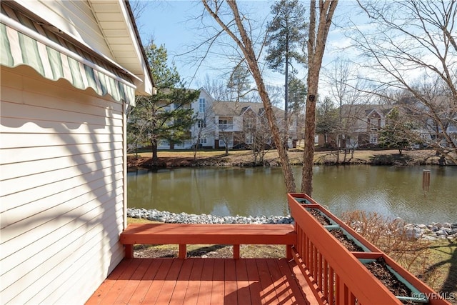 view of dock featuring a deck with water view