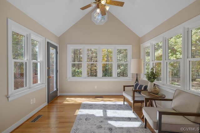 sunroom / solarium with vaulted ceiling and ceiling fan