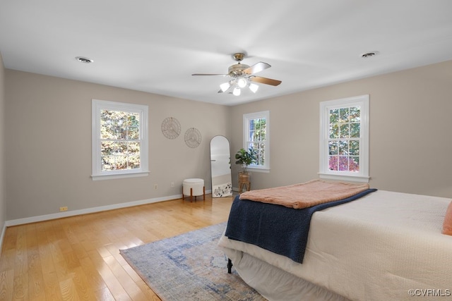 bedroom featuring ceiling fan and light hardwood / wood-style flooring