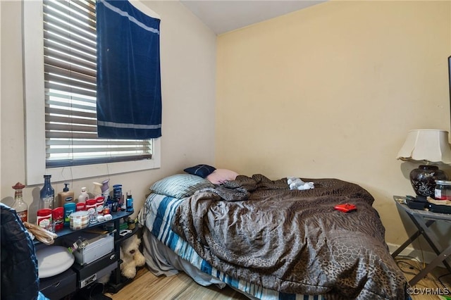 bedroom featuring wood-type flooring