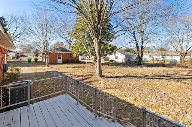 wooden deck featuring cooling unit