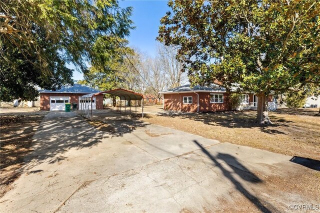 1100 N Ave, Hopewell, VA 23860 - ranch-style home featuring a carport and driveway