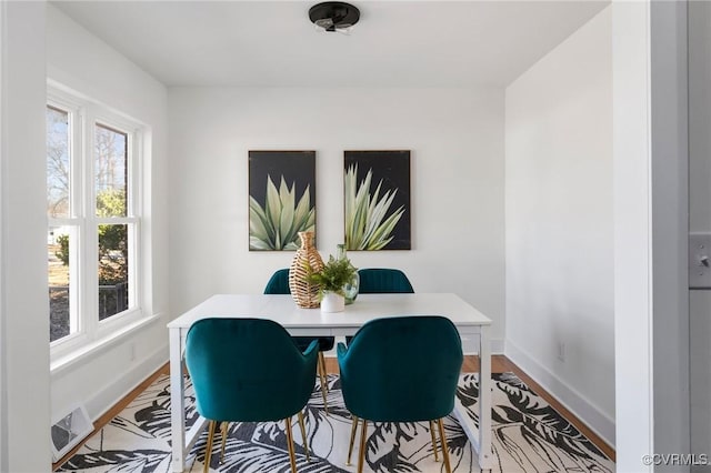 dining area with light wood-type flooring