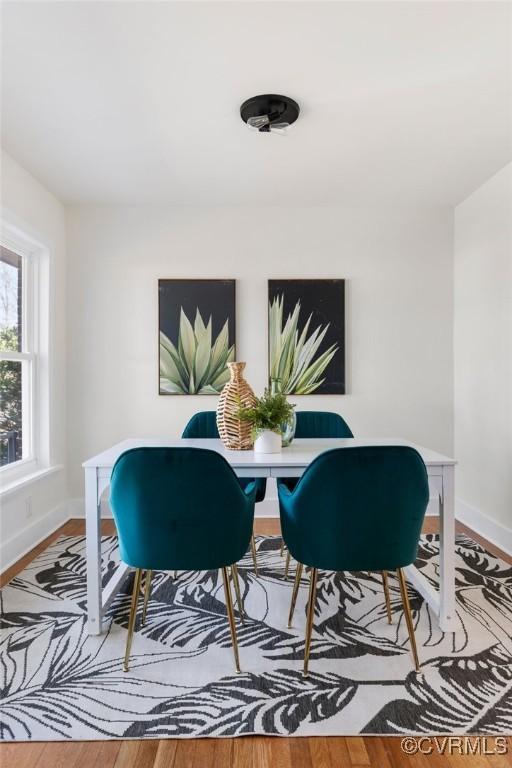 dining area featuring wood-type flooring