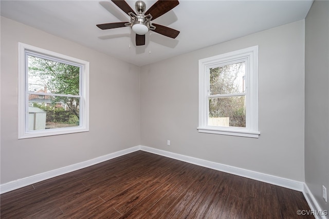 unfurnished room featuring dark hardwood / wood-style floors and ceiling fan