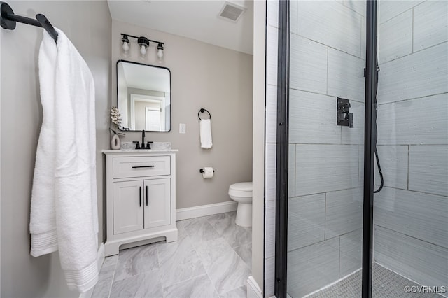 bathroom with vanity, toilet, and walk in shower