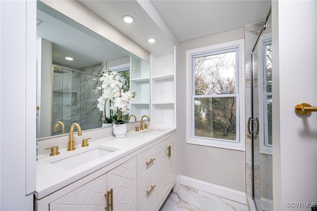 bathroom featuring vanity and an enclosed shower