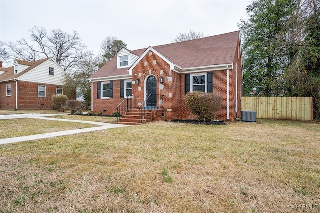 view of front facade with cooling unit and a front yard