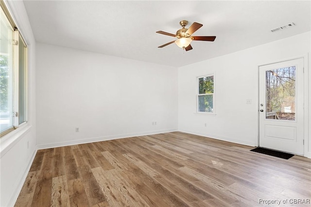 unfurnished room with ceiling fan and light hardwood / wood-style floors