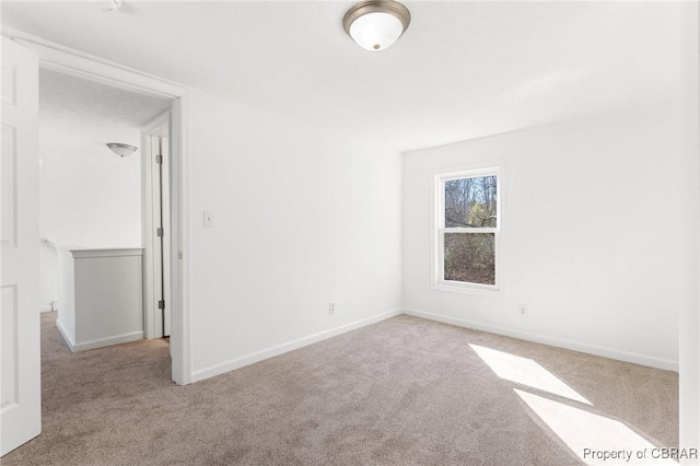 empty room featuring light carpet