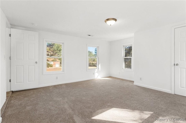 unfurnished room featuring carpet flooring