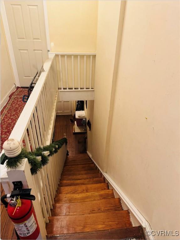 staircase featuring hardwood / wood-style floors